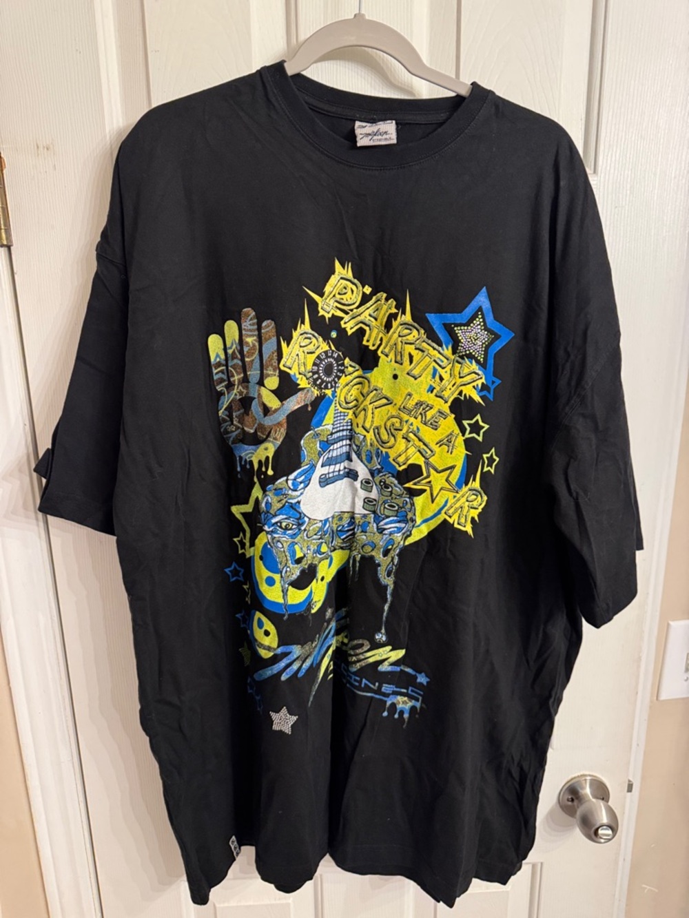Stussy Black Tee with Yellow and Blue Graphic Print
